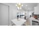 Bright dining area featuring modern lighting, easy access to the kitchen, and comfortable seating for Gathering meals at 15221 N Clubgate Dr # 2094, Scottsdale, AZ 85254