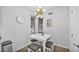 Cozy dining area featuring modern light fixture, neutral decor, and a functional layout for intimate meals at 15221 N Clubgate Dr # 2094, Scottsdale, AZ 85254
