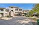 Stunning multi-story home with stucco exterior, concrete driveway, and well-maintained landscaping at 15221 N Clubgate Dr # 2094, Scottsdale, AZ 85254