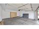Spacious garage interior with ample storage cabinets and clean concrete flooring at 15221 N Clubgate Dr # 2094, Scottsdale, AZ 85254