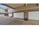 Multiple car garages featuring textured walls and a brick paved area at 15221 N Clubgate Dr # 2094, Scottsdale, AZ 85254