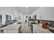 Open concept kitchen showcasing a spacious island, stainless steel appliances, and a seamless flow to the living area at 15221 N Clubgate Dr # 2094, Scottsdale, AZ 85254