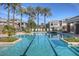 Resort-style pool area surrounded by lounge chairs and lush landscaping, perfect for relaxation and recreation at 15221 N Clubgate Dr # 2094, Scottsdale, AZ 85254