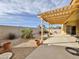 Backyard gravel area with a covered patio at 15950 S Hilo Cir, Arizona City, AZ 85123