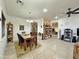 Open-concept living and dining area featuring tile floors and a ceiling fan at 15950 S Hilo Cir, Arizona City, AZ 85123