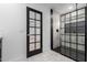 Modern bathroom showcasing a glass shower enclosure with black trim and tiled walls at 16422 S 45Th Pl, Phoenix, AZ 85048