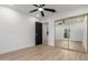 Bedroom featuring mirrored closet doors and ceiling fan at 16422 S 45Th Pl, Phoenix, AZ 85048