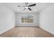 Bedroom featuring a ceiling fan, natural light, and light wood-look flooring at 16422 S 45Th Pl, Phoenix, AZ 85048