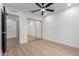 Bedroom featuring mirrored closet doors and ceiling fan at 16422 S 45Th Pl, Phoenix, AZ 85048