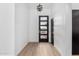 Bright entryway showcasing modern door, sleek black fixtures and stunning light fixture at 16422 S 45Th Pl, Phoenix, AZ 85048