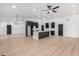 Open kitchen with black cabinets, a center island, and light wood-look flooring at 16422 S 45Th Pl, Phoenix, AZ 85048