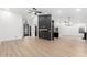 Open-concept living area with high ceilings, sleek floors, striking black accent wall, and ample lighting at 16422 S 45Th Pl, Phoenix, AZ 85048