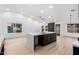 Large living space with a modern kitchen featuring a bright, quartz island at 16422 S 45Th Pl, Phoenix, AZ 85048