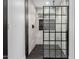 Modern walk in shower featuring marble-look tile, built in niches and glass enclosure at 16422 S 45Th Pl, Phoenix, AZ 85048