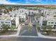 Aerial perspective of a contemporary community showcasing modern residences, mature palm trees, and convenient parking spaces at 1717 E Morten Ave # 2, Phoenix, AZ 85020