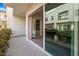 Covered balcony with large sliding glass doors and wooden interior flooring at 1717 E Morten Ave # 2, Phoenix, AZ 85020