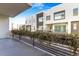 Wide balcony view to the townhomes with flowering vines at 1717 E Morten Ave # 2, Phoenix, AZ 85020