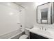 Clean full bathroom featuring a tub and shower combo and a dark vanity at 1717 E Morten Ave # 2, Phoenix, AZ 85020