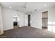 Spacious bedroom featuring neutral carpet and view into adjoining bathroom at 1717 E Morten Ave # 2, Phoenix, AZ 85020