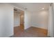 Bedroom with neutral paint, hard surface floors, and a doorway to an adjoining room at 1717 E Morten Ave # 2, Phoenix, AZ 85020