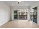 Bedroom featuring tile floors, ceiling fan, and large sliding glass door to balcony at 1717 E Morten Ave # 2, Phoenix, AZ 85020