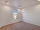 Vacant bedroom featuring plush carpet and a bright window at 1717 E Morten Ave # 2, Phoenix, AZ 85020