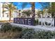 Stylish community entrance sign amidst manicured landscaping and palm trees at 1717 E Morten Ave # 2, Phoenix, AZ 85020