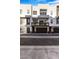 Modern three-story townhome featuring a balcony and attached two-car garage at 1717 E Morten Ave # 2, Phoenix, AZ 85020