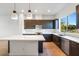 Bright kitchen features stainless steel appliances, quartz countertops, and modern lighting at 1717 E Morten Ave # 2, Phoenix, AZ 85020