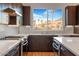 Kitchen features stainless steel appliances, quartz countertops, and a neighborhood view at 1717 E Morten Ave # 2, Phoenix, AZ 85020