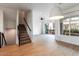 Open-concept living area with tile floors, stairs, and a view of the interior courtyard at 1717 E Morten Ave # 2, Phoenix, AZ 85020
