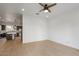 Spacious living room with an open floor plan with tile floors, a ceiling fan, and kitchen at 1717 E Morten Ave # 2, Phoenix, AZ 85020