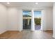 Bright living room with tile floors and access to private patio at 1717 E Morten Ave # 2, Phoenix, AZ 85020