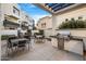 Inviting outdoor patio with a built-in BBQ, multiple seating areas, and stylish modern design at 1717 E Morten Ave # 2, Phoenix, AZ 85020