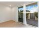 Bedroom with direct access to a private patio and landscaped outdoor space at 1717 E Morten Ave # 2, Phoenix, AZ 85020
