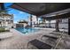 Community pool area with lounge chairs and shade canopy, providing a relaxing outdoor space for residents at 1717 E Morten Ave # 2, Phoenix, AZ 85020