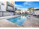 Community pool with sun loungers and palm trees, offering a resort-style experience for residents at 1717 E Morten Ave # 2, Phoenix, AZ 85020