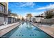 Community pool with hot tub, sun loungers and palm trees, offering a resort-style experience for residents at 1717 E Morten Ave # 2, Phoenix, AZ 85020