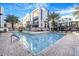 Community pool featuring lounge chairs and a modern designed building at 1717 E Morten Ave # 2, Phoenix, AZ 85020