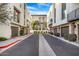 Street view of modern townhomes featuring attached garages and manicured front yards at 1717 E Morten Ave # 2, Phoenix, AZ 85020