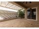 Covered patio with decorative lighting, planter and tiled flooring at 21031 W Elm Way Ct, Buckeye, AZ 85396