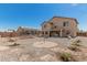 Large backyard with gravel landscaping, trampoline and grill. Perfect for entertaining guests at 25420 W Park Ave, Buckeye, AZ 85326
