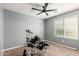 Bedroom with neutral walls, modern ceiling fan, and bright window; great natural light throughout at 25420 W Park Ave, Buckeye, AZ 85326