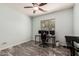 Spacious bedroom with marble floors, a ceiling fan, and room for a home gym at 25420 W Park Ave, Buckeye, AZ 85326