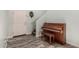 Inviting entryway showcasing stylish tiled flooring and a classic piano at 25420 W Park Ave, Buckeye, AZ 85326