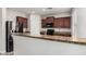 Modern kitchen featuring granite countertops, stainless steel appliances, and ample cabinet space at 25420 W Park Ave, Buckeye, AZ 85326