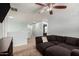Spacious loft area with comfortable sofa, neutral carpet, and airy feel with view of hallway at 25420 W Park Ave, Buckeye, AZ 85326