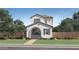 Charming two-story home featuring a stucco exterior, arched entryway, desert landscaping and a tiled roof at 2938 N 98Th Ln, Phoenix, AZ 85037