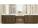 Elegant bathroom featuring double vanity sinks, a large mirror, and a makeup area at 2940 N 98Th Ln, Phoenix, AZ 85037