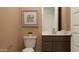 Tastefully designed bathroom with a modern vanity, toilet, and neutral color scheme at 2940 N 98Th Ln, Phoenix, AZ 85037